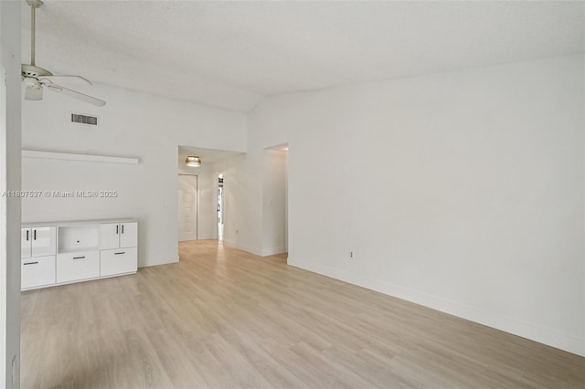 731 Briarwood Ter, Davie, FL 33325 - empty room featuring light wood-type flooring, ceiling fan, vaulted ceiling, and baseboards