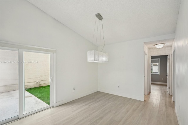 731 Briarwood Ter, Davie, FL 33325 - unfurnished dining area featuring wood finished floors, baseboards, and a textured ceiling