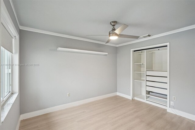 731 Briarwood Ter, Davie, FL 33325 - unfurnished bedroom with wood finished floors, baseboards, a closet, a ceiling fan, and ornamental molding