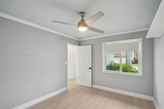 731 Briarwood Ter, Davie, FL 33325 - unfurnished bedroom featuring light wood-style floors, baseboards, ornamental molding, and a ceiling fan