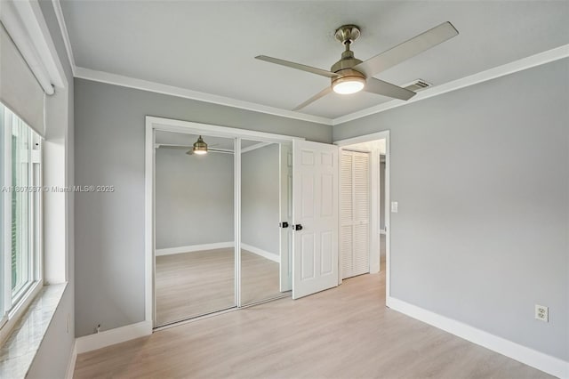731 Briarwood Ter, Davie, FL 33325 - unfurnished bedroom featuring wood finished floors, multiple windows, baseboards, and crown molding