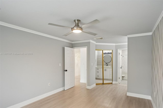 731 Briarwood Ter, Davie, FL 33325 - unfurnished bedroom featuring light wood-style flooring, baseboards, ornamental molding, ensuite bath, and ceiling fan