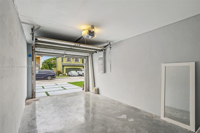 731 Briarwood Ter, Davie, FL 33325 - garage featuring a garage door opener and electric panel
