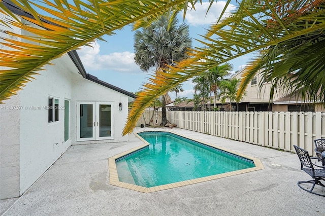 731 Briarwood Ter, Davie, FL 33325 - view of swimming pool with french doors, a patio area, and a fenced backyard