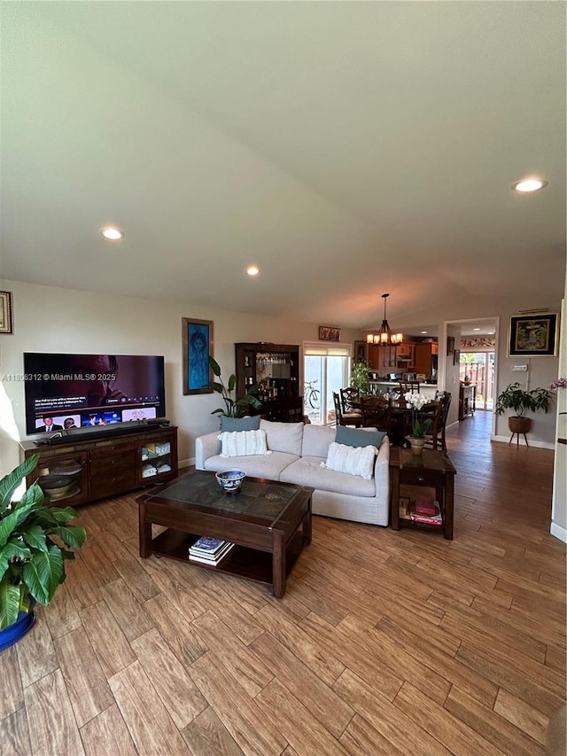 12680 SW 144th Ter, Miami, FL 33186 - living room with light wood-type flooring, a chandelier, and recessed lighting