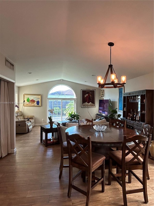 12680 SW 144th Ter, Miami, FL 33186 - dining space featuring lofted ceiling, wood-type flooring, and a chandelier