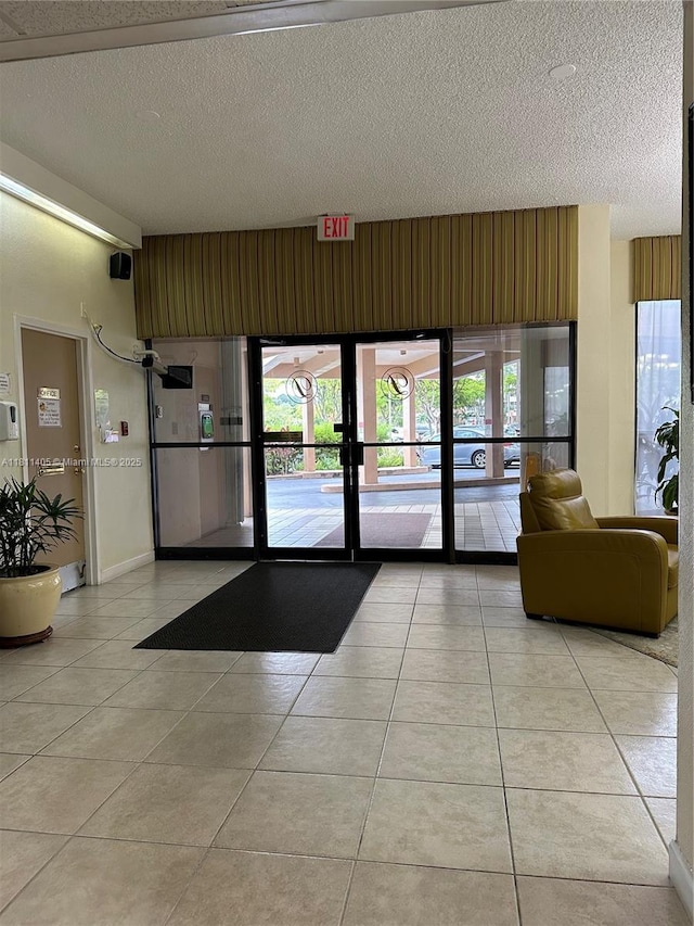 1100 NW Saint Charles Pl Unit 411, Pembroke Pines, FL 33026 - lobby with a textured ceiling