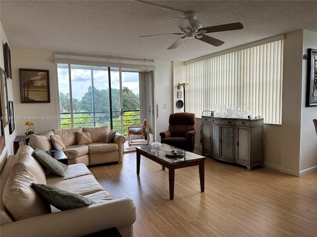 1100 NW Saint Charles Pl Unit 411, Pembroke Pines, FL 33026 - living area with light wood finished floors, ceiling fan, and a textured ceiling