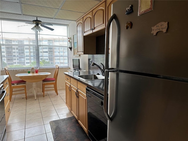 1100 NW Saint Charles Pl Unit 411, Pembroke Pines, FL 33026 - kitchen featuring freestanding refrigerator, black dishwasher, a sink, ceiling fan, and light tile patterned flooring