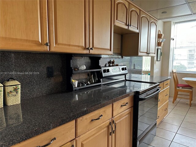 1100 NW Saint Charles Pl Unit 411, Pembroke Pines, FL 33026 - kitchen featuring black / electric stove, light tile patterned flooring, and decorative backsplash