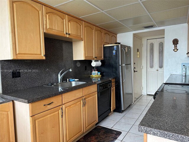 1100 NW Saint Charles Pl Unit 411, Pembroke Pines, FL 33026 - kitchen with black appliances, a sink, light tile patterned flooring, tasteful backsplash, and dark countertops
