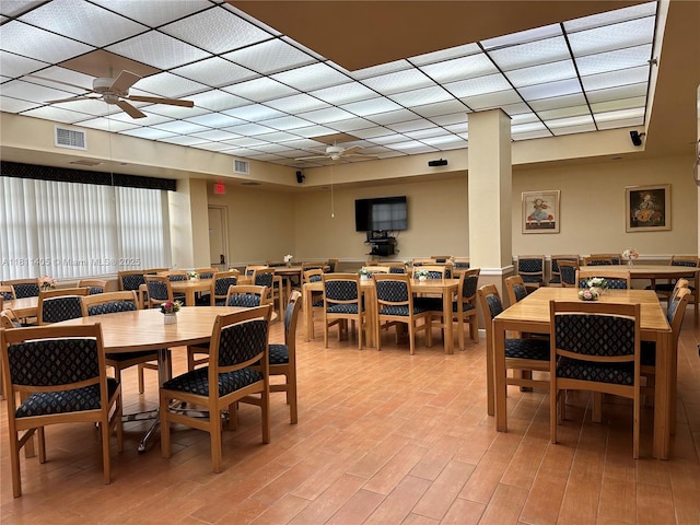 1100 NW Saint Charles Pl Unit 411, Pembroke Pines, FL 33026 - dining room with a ceiling fan, light wood finished floors, and a paneled ceiling