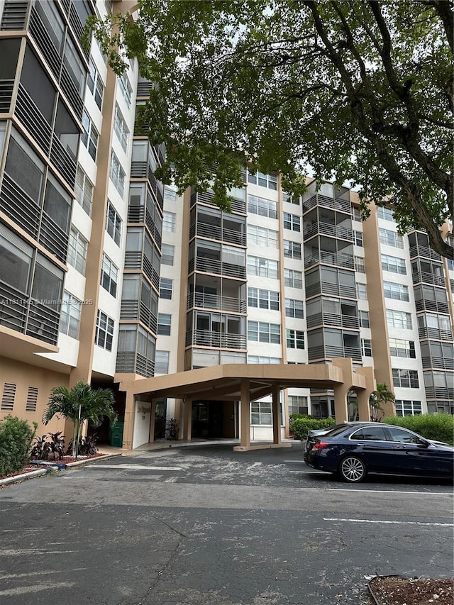 1100 NW Saint Charles Pl Unit 411, Pembroke Pines, FL 33026 - view of apartment building / complex with uncovered parking