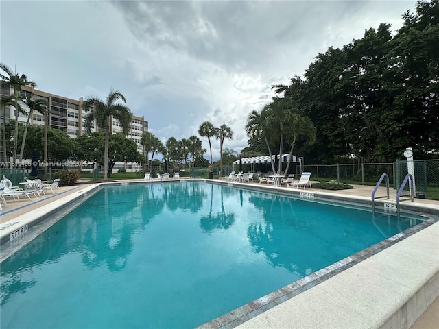 1100 NW Saint Charles Pl Unit 411, Pembroke Pines, FL 33026 - community pool with a patio