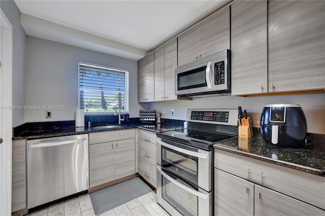 1775 N Andrews Sq Unit 104W, Fort Lauderdale, FL 33311 - kitchen with stainless steel appliances and dark stone countertops