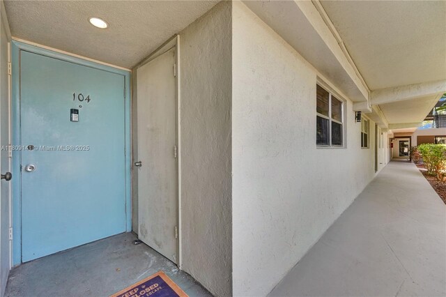 1775 N Andrews Sq Unit 104W, Fort Lauderdale, FL 33311 - view of exterior entry featuring stucco siding