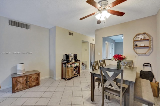 1775 N Andrews Sq Unit 104W, Fort Lauderdale, FL 33311 - dining space with ceiling fan, light tile patterned flooring, and a textured ceiling