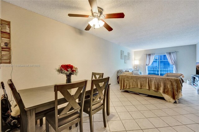 1775 N Andrews Sq Unit 104W, Fort Lauderdale, FL 33311 - dining space with a textured ceiling, ceiling fan, and light tile patterned flooring