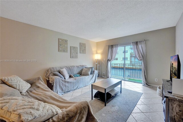 1775 N Andrews Sq Unit 104W, Fort Lauderdale, FL 33311 - living area with light tile patterned floors and a textured ceiling