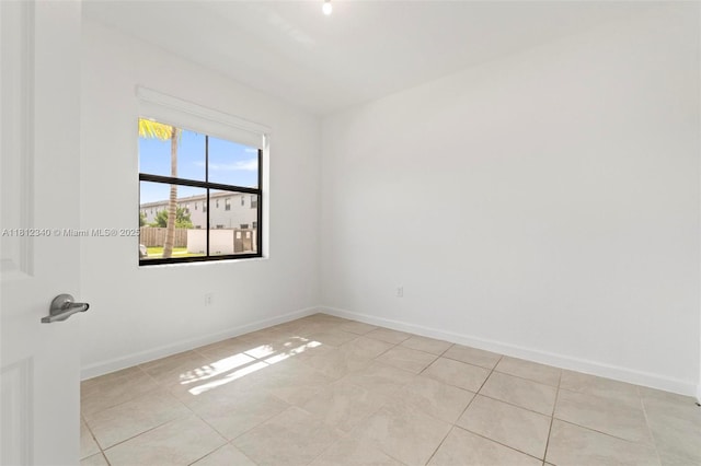 28581 SW 132nd Ct, Homestead, FL 33033 - unfurnished room with light tile patterned flooring and baseboards