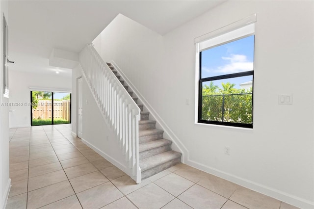 28581 SW 132nd Ct, Homestead, FL 33033 - stairway featuring tile patterned flooring and baseboards