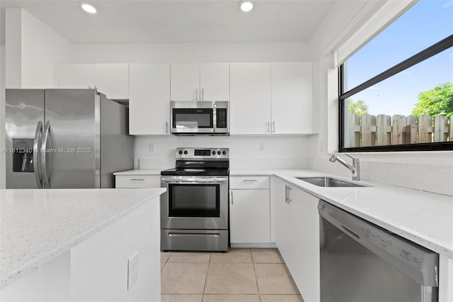 28581 SW 132nd Ct, Homestead, FL 33033 - kitchen with appliances with stainless steel finishes, a sink, white cabinetry, and recessed lighting