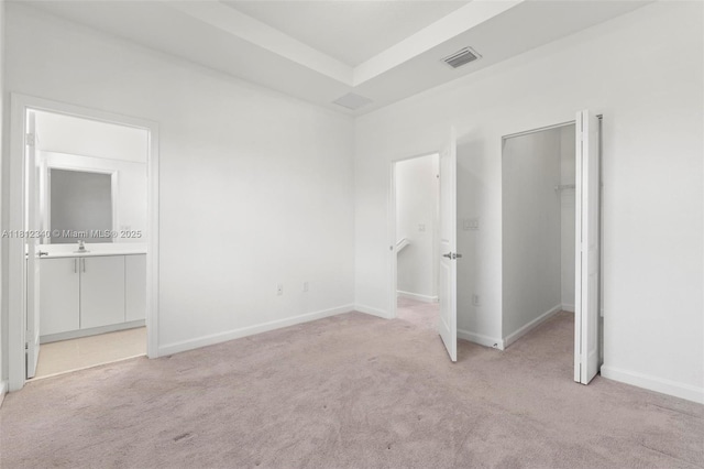 28581 SW 132nd Ct, Homestead, FL 33033 - unfurnished bedroom with a walk in closet, light carpet, ensuite bath, and baseboards