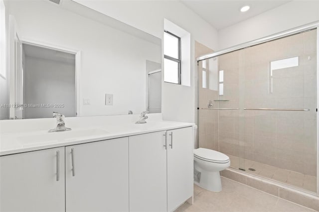 28581 SW 132nd Ct, Homestead, FL 33033 - bathroom featuring a stall shower, double vanity, toilet, tile patterned floors, and recessed lighting