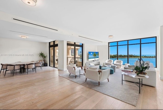 7055 Fisher Island Dr Unit 7055, Miami Beach, FL 33109 - living room featuring wood finished floors and expansive windows