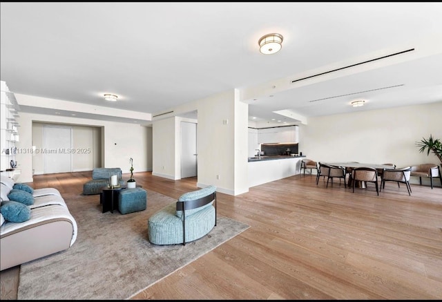 7055 Fisher Island Dr Unit 7055, Miami Beach, FL 33109 - living room featuring light wood-type flooring