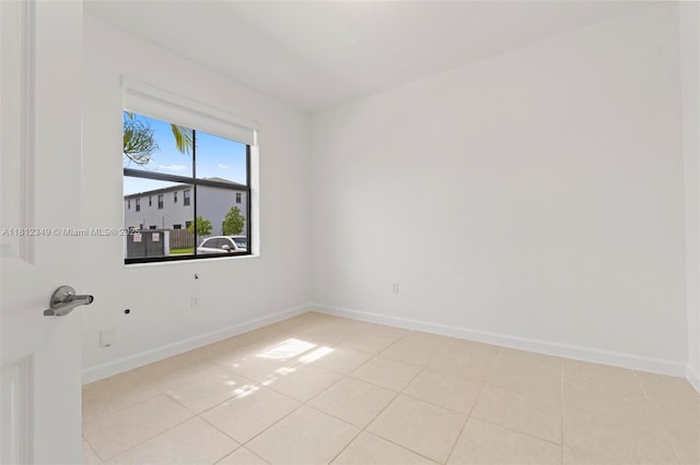 28569 SW 132nd Ct, Homestead, FL 33033 - spare room featuring baseboards and light tile patterned flooring