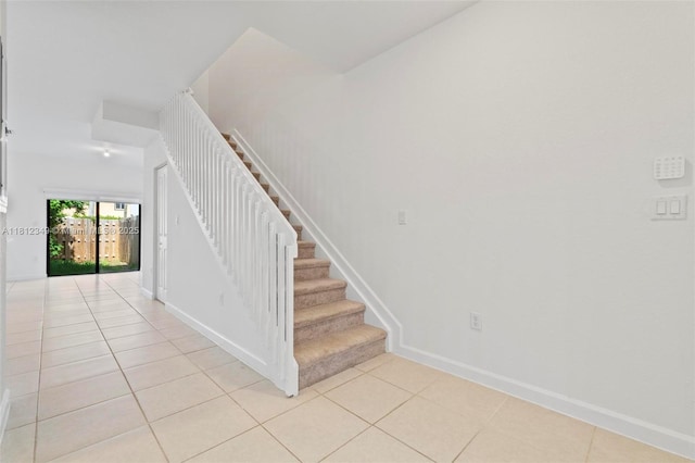 28569 SW 132nd Ct, Homestead, FL 33033 - staircase featuring tile patterned flooring and baseboards