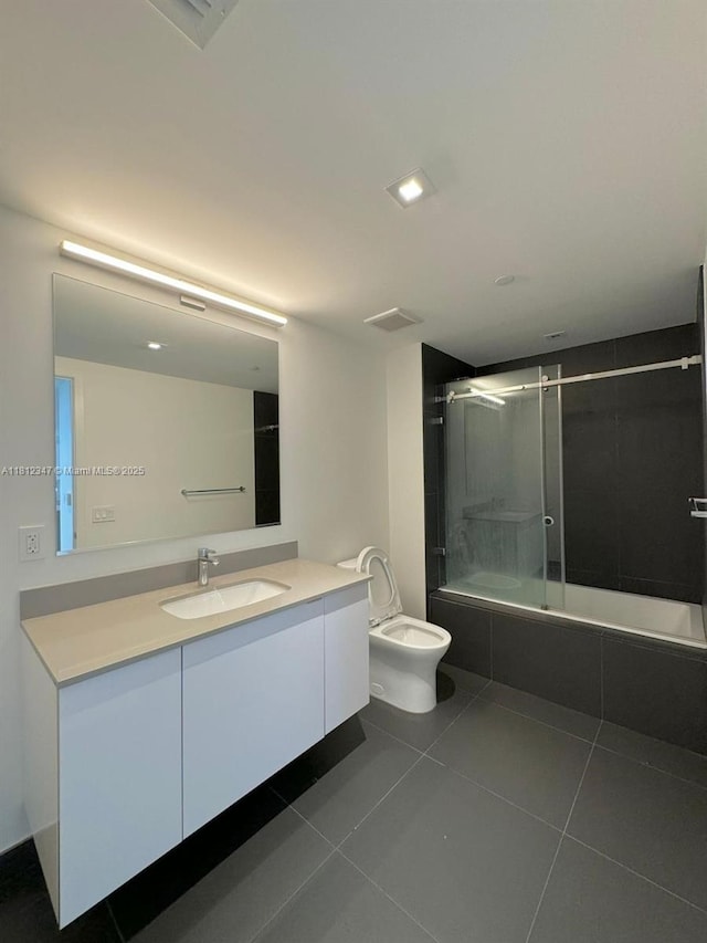 1600 NE 1st Ave Unit 2917, Miami, FL 33132 - full bathroom featuring tiled shower / bath, vanity, tile patterned flooring, and toilet