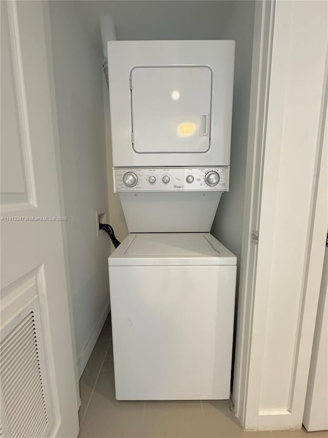 1600 NE 1st Ave Unit 2917, Miami, FL 33132 - laundry area with stacked washer / dryer and light tile patterned floors