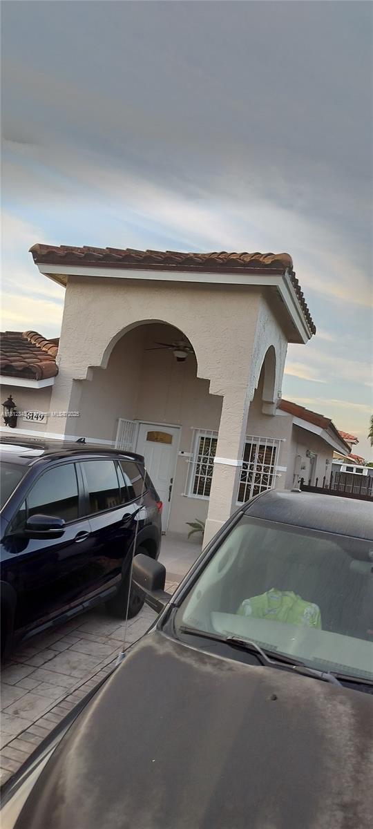 3149 W 68th Pl, Hialeah, FL 33018 - view of side of property with stucco siding