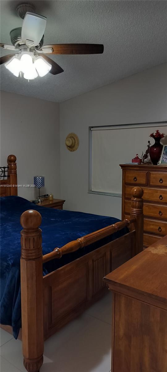 3149 W 68th Pl, Hialeah, FL 33018 - bedroom featuring a textured ceiling and ceiling fan