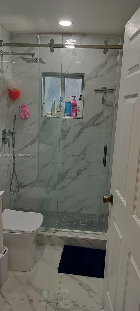 3149 W 68th Pl, Hialeah, FL 33018 - full bathroom with toilet, a marble finish shower, marble finish floors, and recessed lighting