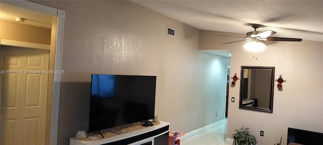 3149 W 68th Pl, Hialeah, FL 33018 - living room with a ceiling fan, baseboards, a textured ceiling, and light tile patterned floors