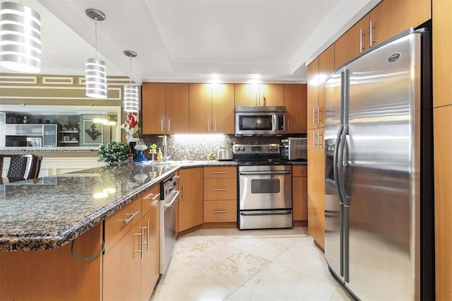 1865 S Ocean Dr Unit 18G, Hallandale Beach, FL 33009 - kitchen featuring stainless steel appliances, a peninsula, backsplash, decorative light fixtures, and a raised ceiling