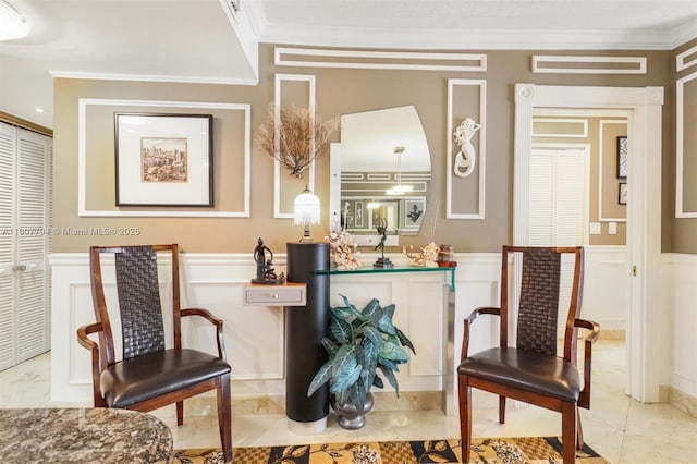 1865 S Ocean Dr Unit 18G, Hallandale Beach, FL 33009 - living area featuring a decorative wall, ornamental molding, and wainscoting