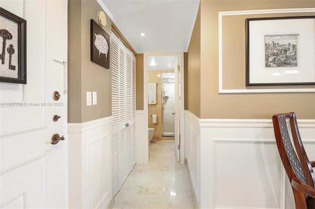 1865 S Ocean Dr Unit 18G, Hallandale Beach, FL 33009 - hall featuring wainscoting, a decorative wall, light marble finish flooring, and recessed lighting