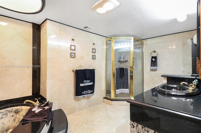 1865 S Ocean Dr Unit 18G, Hallandale Beach, FL 33009 - bathroom featuring a stall shower, a garden tub, marble tiled floors, and vanity