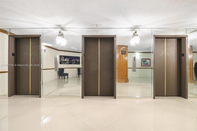 1865 S Ocean Dr Unit 18G, Hallandale Beach, FL 33009 - hallway featuring elevator, ornamental molding, tile patterned flooring, and a textured ceiling