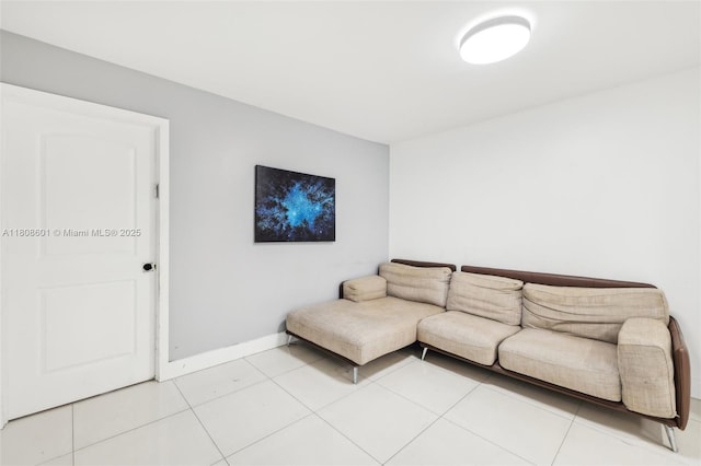 1351 NE Miami Gardens Dr Unit 1111E, Miami, FL 33179 - living room featuring baseboards and light tile patterned floors