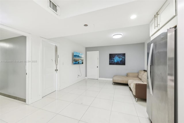 1351 NE Miami Gardens Dr Unit 1111E, Miami, FL 33179 - living area with baseboards and light tile patterned floors