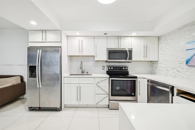 1351 NE Miami Gardens Dr Unit 1111E, Miami, FL 33179 - kitchen with stainless steel appliances, a sink, tasteful backsplash, light countertops, and recessed lighting