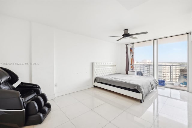 1351 NE Miami Gardens Dr Unit 1111E, Miami, FL 33179 - tiled bedroom featuring a view of city, floor to ceiling windows, a ceiling fan, and baseboards