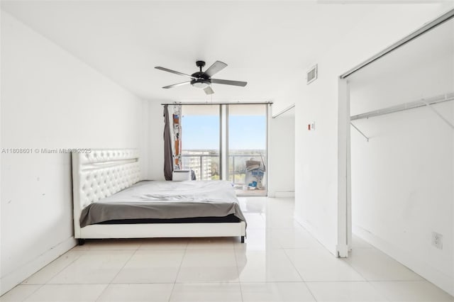 1351 NE Miami Gardens Dr Unit 1111E, Miami, FL 33179 - bedroom with floor to ceiling windows and ceiling fan