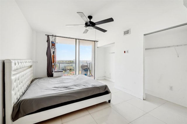 1351 NE Miami Gardens Dr Unit 1111E, Miami, FL 33179 - bedroom with a closet, light tile patterned flooring, and ceiling fan