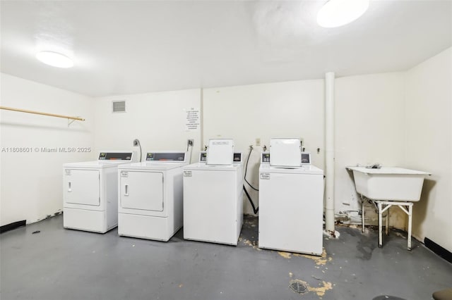1351 NE Miami Gardens Dr Unit 1111E, Miami, FL 33179 - shared laundry room with independent washer and dryer